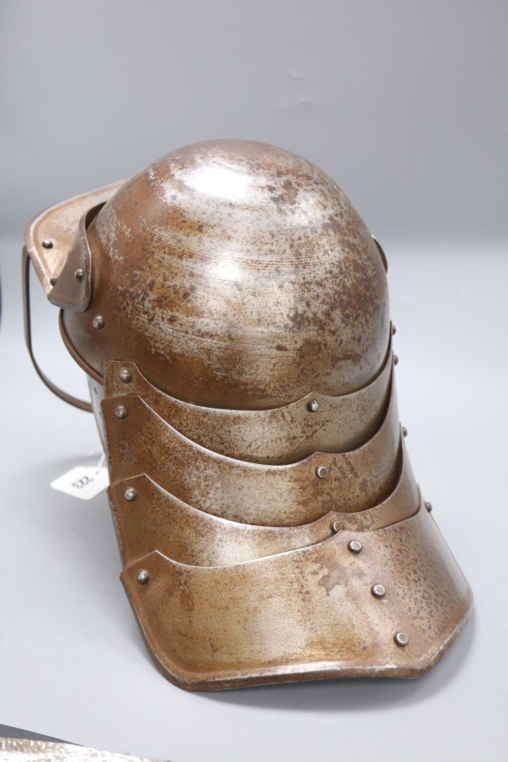 A reproduction English Civil War lobster tail helmet, length 49cm approx.